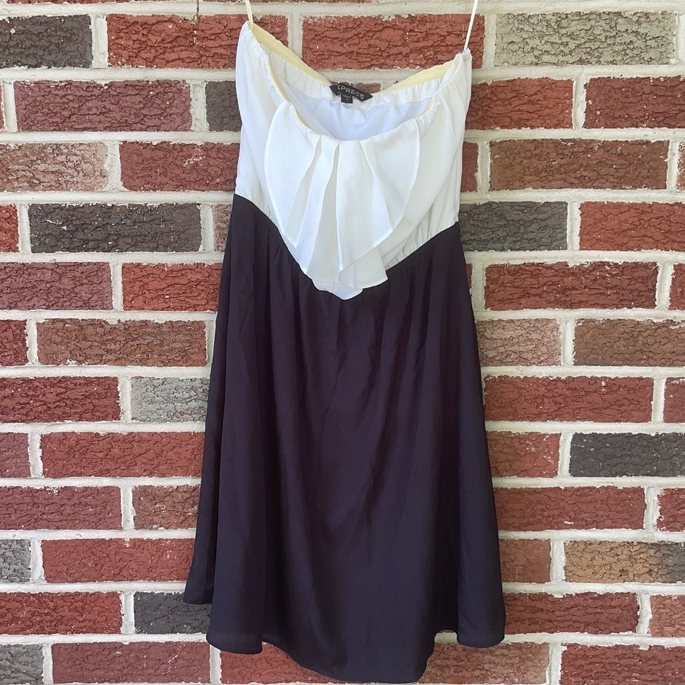 Express strapless dress with ruffle on the chest. Size is a 04.